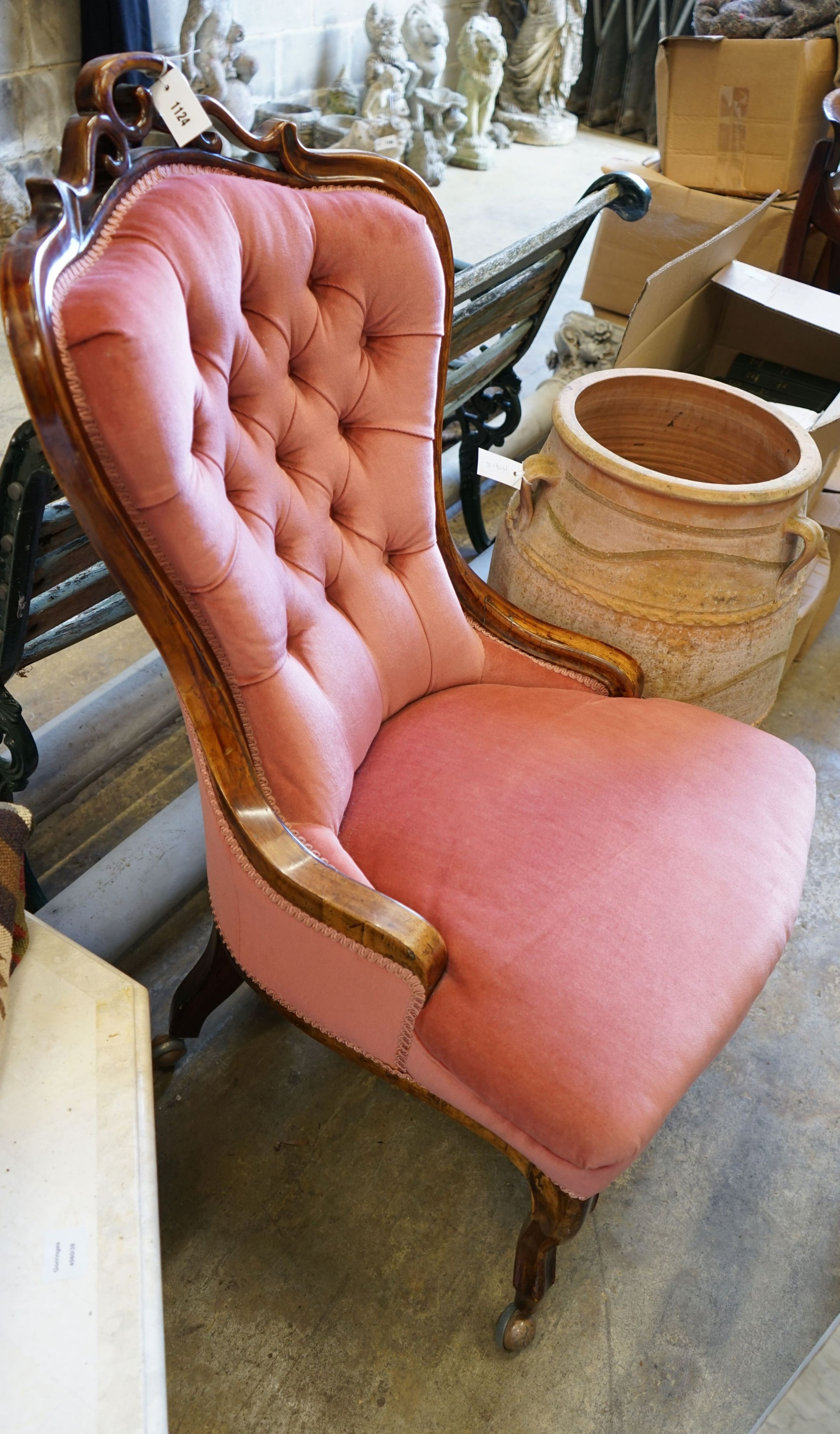 A 19th century Hungarian carved walnut upholstered spoonback nursing chair